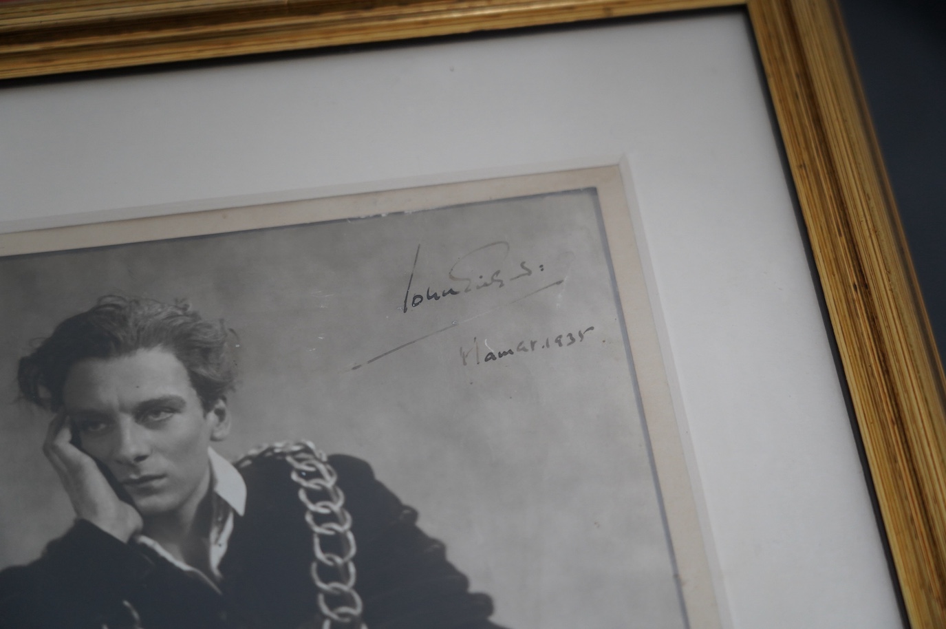 A theatrical archive of signed photos, a poster and books relating to John Gielgud and Laurence Olivier, including; a framed signed photograph of John Gielgud as Hamlet dated 1935, together with two signed photographs da